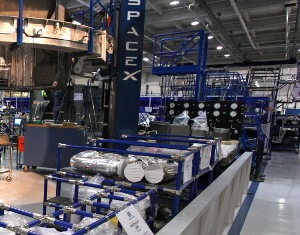view of a 21st century manufacturing plan with many machines in a very large indoor area